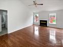 Bright living room featuring vaulted ceiling and fireplace at 4627 Avalon Forest Ln, Charlotte, NC 28269