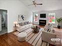Bright living room featuring vaulted ceiling, fireplace, and an open layout perfect for entertaining at 4627 Avalon Forest Ln, Charlotte, NC 28269