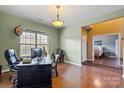Bright home office with hardwood floors, large window, and a comfortable workspace at 806 Irish Green Dr, Clover, SC 29710