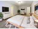 Well-lit primary bedroom featuring a neutral palette, a large bed, and ample closet space at 8619 Harris Lake Ln, Charlotte, NC 28269