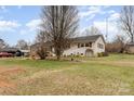 Expansive backyard featuring a lush lawn, mature trees, and an open space at 127 Wright Cir, Cherryville, NC 28021