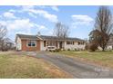 Charming single-story home with a well-manicured lawn and a welcoming entrance at 127 Wright Cir, Cherryville, NC 28021