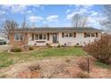 Charming single-story home with a well-manicured lawn and a welcoming entrance at 127 Wright Cir, Cherryville, NC 28021