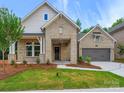 Charming brick home with a well-manicured lawn and inviting covered entryway at 13134 Macon Hall Dr, Mint Hill, NC 28227