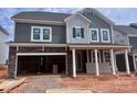 Striking two-story home with stone accents, a welcoming porch, and an attached two-car garage at 13308 Chopin Ridge Rd, Huntersville, NC 28078