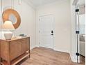 Inviting entryway with decorative mirror, stylish cabinet, and access to living spaces at 13736 Roderick Dr # 171, Huntersville, NC 28078