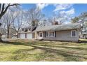 Charming home featuring a spacious front lawn and an attached two-car garage for convenient parking at 15905 Sunset Dr, Huntersville, NC 28078