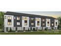 Modern townhome exterior with black and white facade, well-maintained lawn, and inviting entryways at 3202 Riley Ave, Charlotte, NC 28269