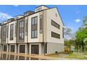 The exterior of a new construction home with multiple levels and a modern design aesthetic at 3202 Riley Ave, Charlotte, NC 28269