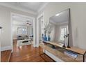 Elegant foyer with hardwood floors, decorative console table, mirror and trim, creating a stylish entry at 416 Eli St, Charlotte, NC 28204