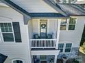 Close up of balcony with seating and entry to home at 5050 Watersail Way, Lake Wylie, SC 29710