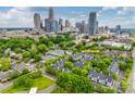 Daytime aerial view of the property showcasing the landscape and the downtown skyline at 509 N Graham St # 2D, Charlotte, NC 28202
