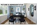 Well-lit office featuring a large window, modern decor, and a comfortable workspace at 122 Woodhall Way, Troutman, NC 28166