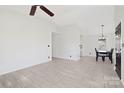 Spacious living room featuring tile floors, ceiling fan, and neutral paint at 1304 Browdis Ave, Kannapolis, NC 28083