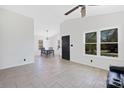 Bright living room with vaulted ceilings, tile flooring, and natural light at 1304 Browdis Ave, Kannapolis, NC 28083