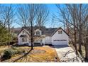 Well-maintained home with an attached garage and lovely landscaping at 1517 Rice Hope Ct, Gastonia, NC 28056