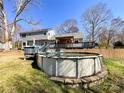 A sprawling backyard featuring an above-ground pool and a large wooden deck at 1589 E Lakewood Dr, Rock Hill, SC 29732