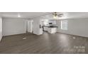 Open-concept living room featuring wood-look flooring and a ceiling fan at 2005 Sugar Hill Rd, York, SC 29745