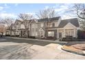 View of well-maintained townhomes with manicured landscaping and ample parking at 2511 Brackley Nw Pl # 1013, Concord, NC 28027