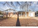 A single story home with brick and vinyl siding, a covered porch, and an attached garage at 2888 Robinson Rd, Newton, NC 28658