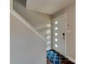 Bright entryway with a modern door, keypad, and a patterned blue rug at 307 French St, Charlotte, NC 28216