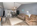 Open-concept living room with ceiling fan, dining area, and easy access to the kitchen at 543 Weavers Xing, Fort Mill, SC 29715