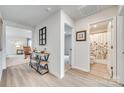 Hallway features wood-look floors, an industrial-style console table, and access to the bathroom and living areas at 908 Morien St, Richburg, SC 29729