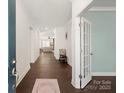 Inviting foyer with hardwood floors leads to a spacious living area at 11031 Larkslea Ln, Charlotte, NC 28278