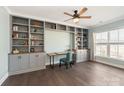 Charming office with custom built-in bookshelves and a cozy atmosphere at 11031 Larkslea Ln, Charlotte, NC 28278
