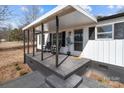 Charming covered front porch with seating, fresh paint, and inviting entrance at 125 Crescent Heights Dr, Salisbury, NC 28146