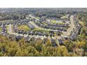A captivating aerial view of a community featuring well-maintained homes surrounded by mature trees at 143 Glenn Dr, Mooresville, NC 28115