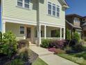 Charming home exterior boasts manicured landscaping and a lovely front porch, perfect for relaxing at 1538 Riverwalk Pkwy, Rock Hill, SC 29730