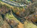 Overhead shot showcasing the neighborhood's proximity to green spaces, walking trails, and a small pond at 2894 Westshore Pl, Denver, NC 28037