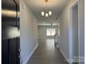 Inviting entryway with modern light fixture and wood-look flooring at 2924 Noritake Trl # 59, Albemarle, NC 28001