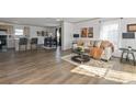 Open-concept living area featuring hardwood floors and seamless flow to kitchen and dining at 2950 Old Cliffside Rd, Shelby, NC 28152