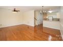 Bright living room featuring hardwood floors, a ceiling fan, and an open layout at 349 Valley Brook Se Ln, Concord, NC 28025