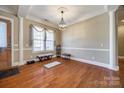 Spacious living area featuring hardwood floors, elegant columns, and natural light at 4103 Belle Meade Cir, Belmont, NC 28012