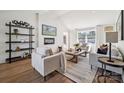 Inviting living room with a modern fireplace, decorative shelving, large window, and stylish furnishings at 4931 Baylor Dr, Charlotte, NC 28210