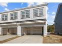 Two-car garage in a modern townhome, offering ample parking and storage space at 5013 Cherry Gum Ct, Matthews, NC 28105