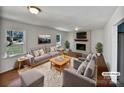 Bright living room featuring a brick fireplace, hardwood floors and natural light at 700 Hickory Ct, Gastonia, NC 28056
