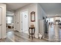 Hallway featuring wood floors, decorative accents, with views into other rooms of the home at 715 Bonica Ct, Lancaster, SC 29720