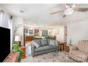 Open-concept living space flows to kitchen, dining area with hardwood floors and neutral walls at 9740 Wardley Dr, Charlotte, NC 28215
