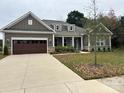 Inviting single-story home with a two car garage and covered entrance at 10521 Ardley Manor Dr, Mint Hill, NC 28227