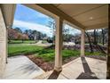 View from the covered porch, showcasing the neighborhood and natural surroundings at 1202 Louise Ln, Albemarle, NC 28001