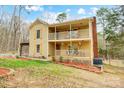 Charming two-story home with a double front porch, pergola, and well-manicured lawn at 1426 Crescent St, Monroe, NC 28112