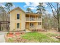 Charming two-story home with a double front porch and well-manicured lawn at 1426 Crescent St, Monroe, NC 28112