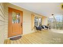 Inviting covered porch with seating, perfect for enjoying the outdoors at 1426 Crescent St, Monroe, NC 28112