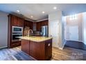 Spacious kitchen with stainless steel appliances, island, and stylish cabinetry at 2017 Bridleside Dr, Indian Trail, NC 28079