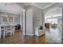 Spacious foyer leading to dining and living areas, featuring hardwood floors and elegant archways at 224 Mills Ln, Fort Mill, SC 29708