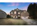 Charming brick two-story home with well-maintained landscaping and attached two-car garage at 2283 Iron Works Dr, Clover, SC 29710